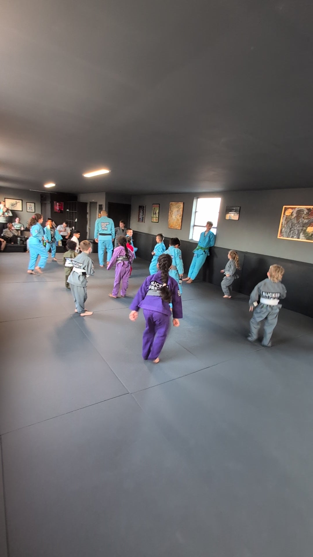Load video: Coach Weiss directing the kids class through "Coach Weiss Says" - a game like Simon Says, where Coaches call out techniques and movements for the kids to build muscle memory and engage all of them in a single activity together.